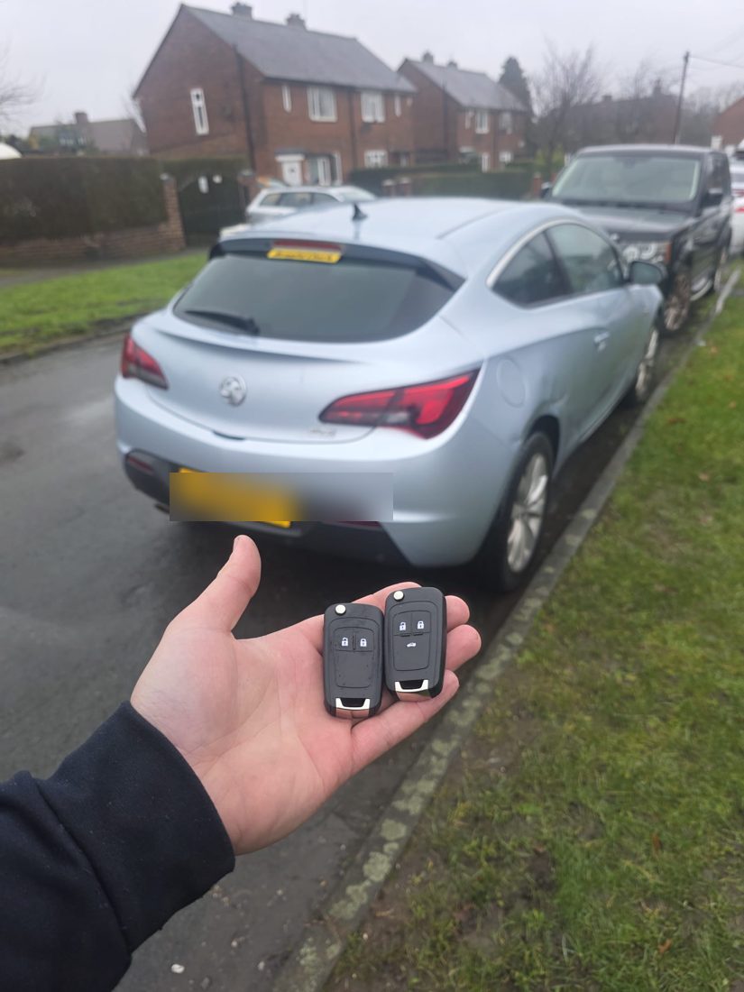 Two matching remote flip keys freshly cut and programmed for a car