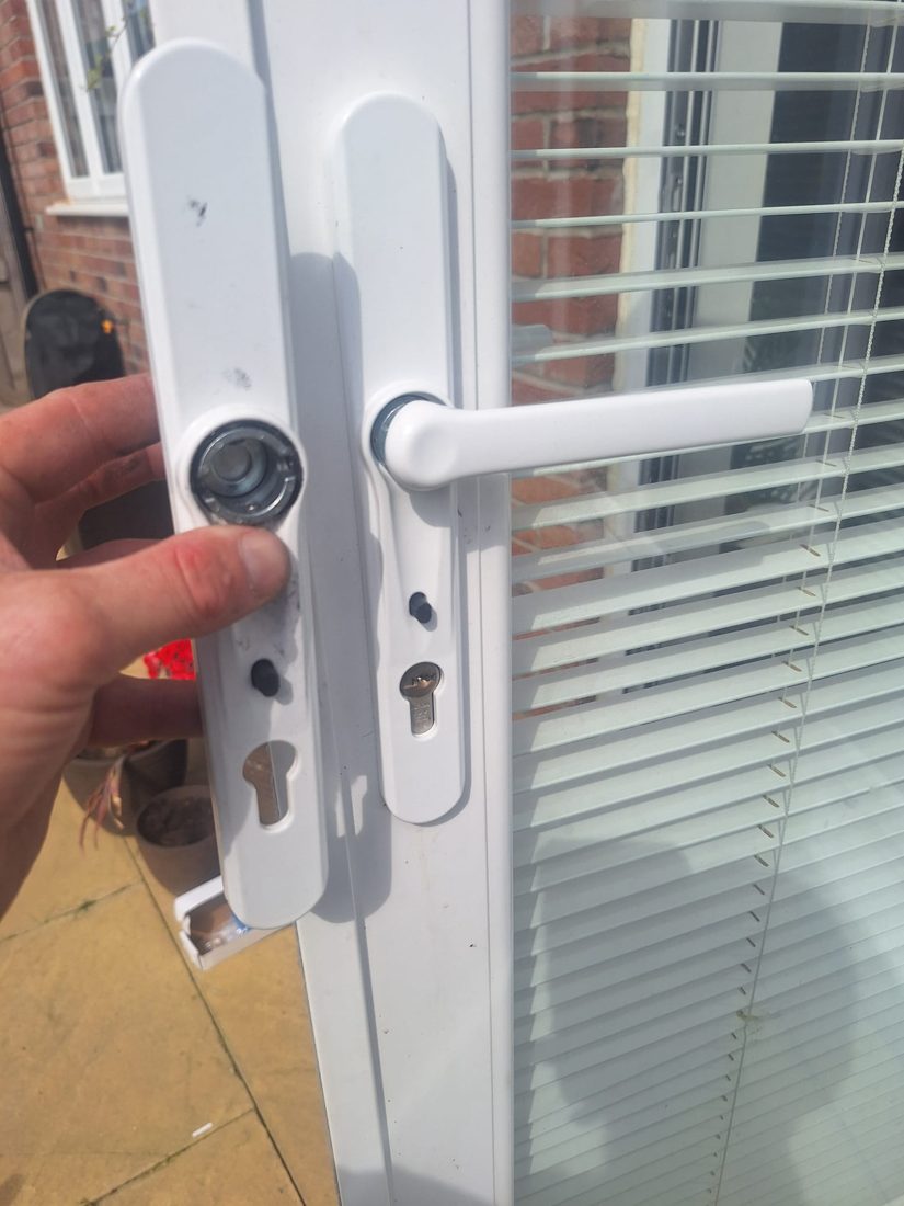 A snapped bifold door handle being replaced with a new multipoint handle