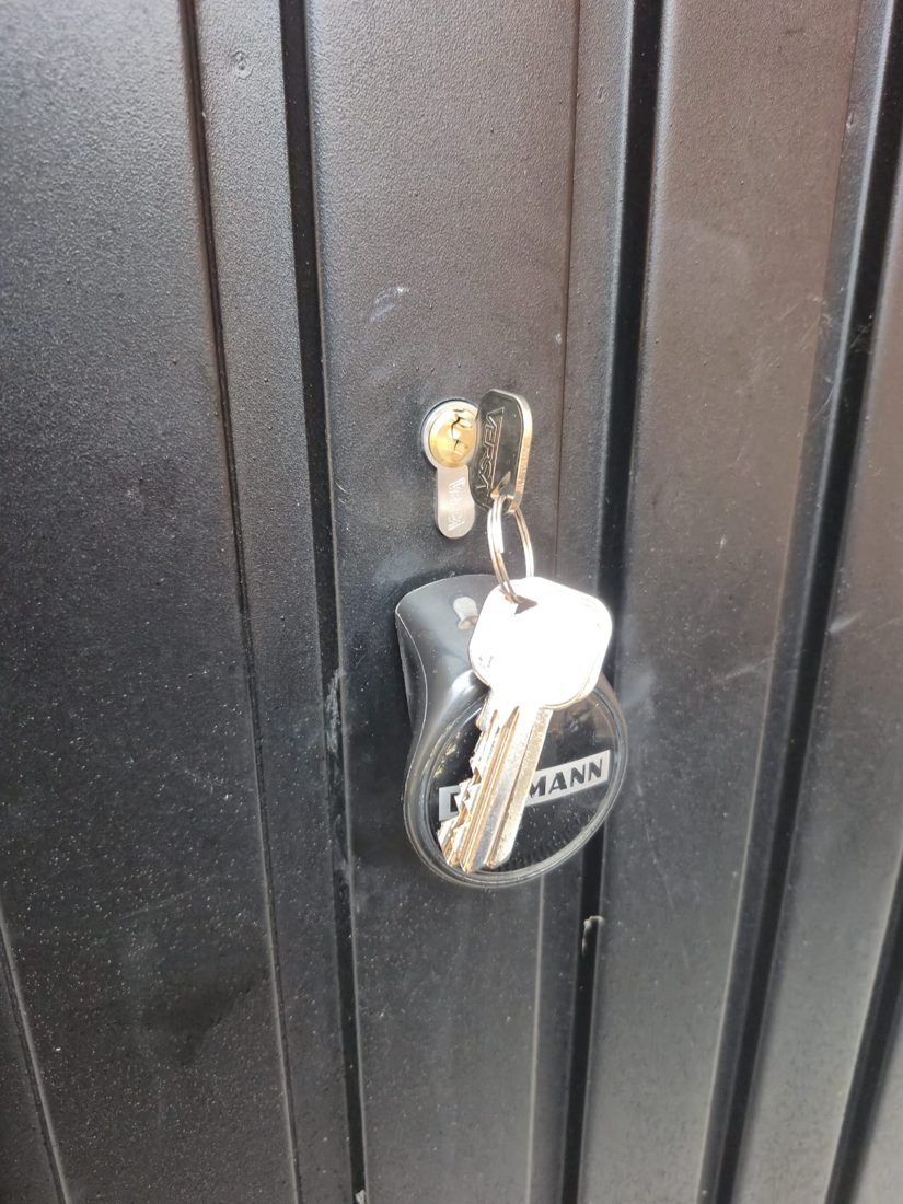 A euro cylinder and keys fitted to a timber garage door