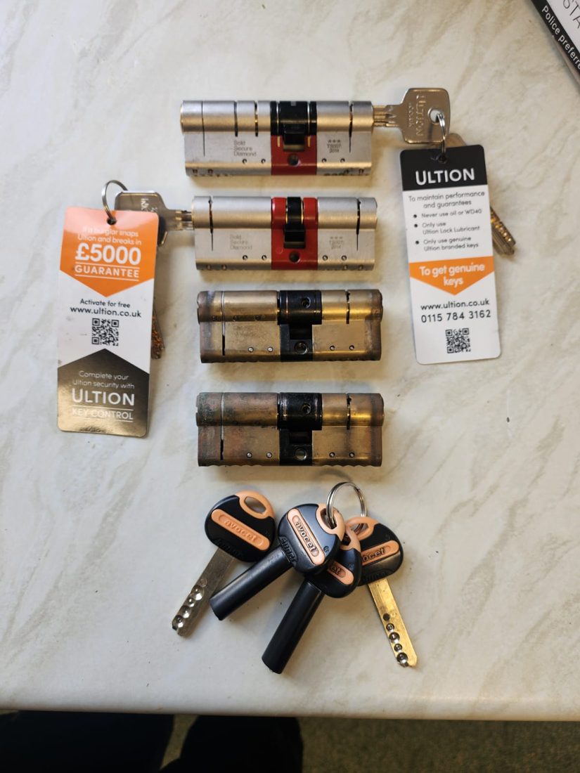 A set of anti-snap Ultion cylinders with key-control guarantee tags and new keys