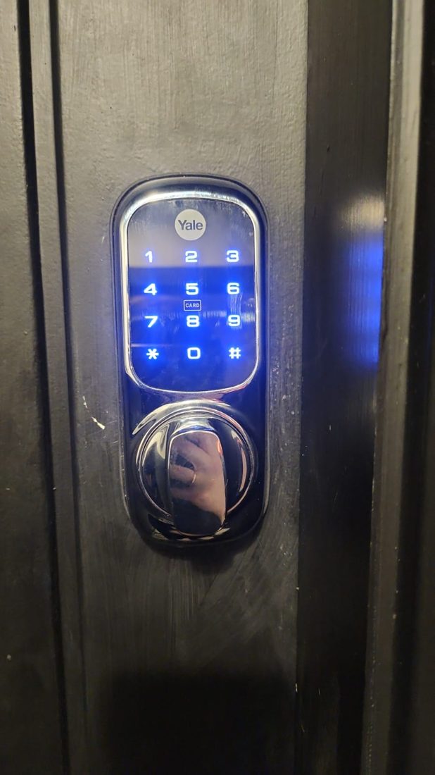 Yales smart keyless access device on the flat door — Lock Change by LocksmithLocal