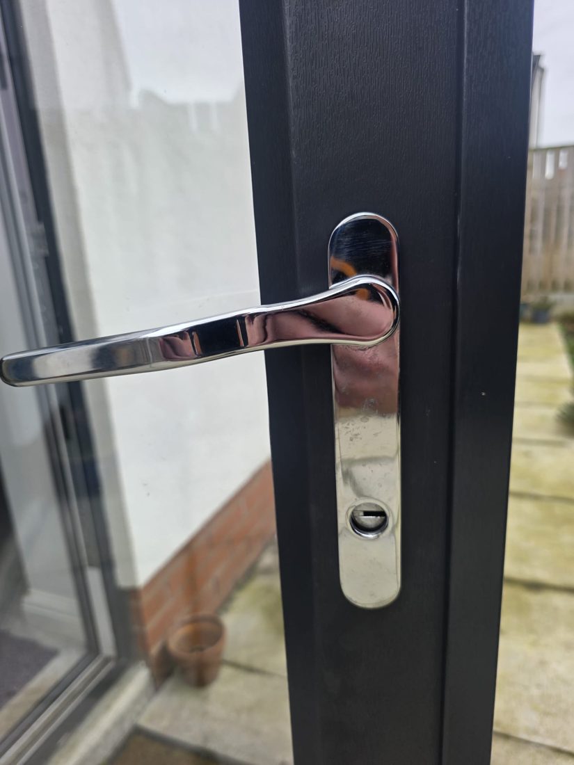 A new chrome lever handle fitted to an anthracite bifold door