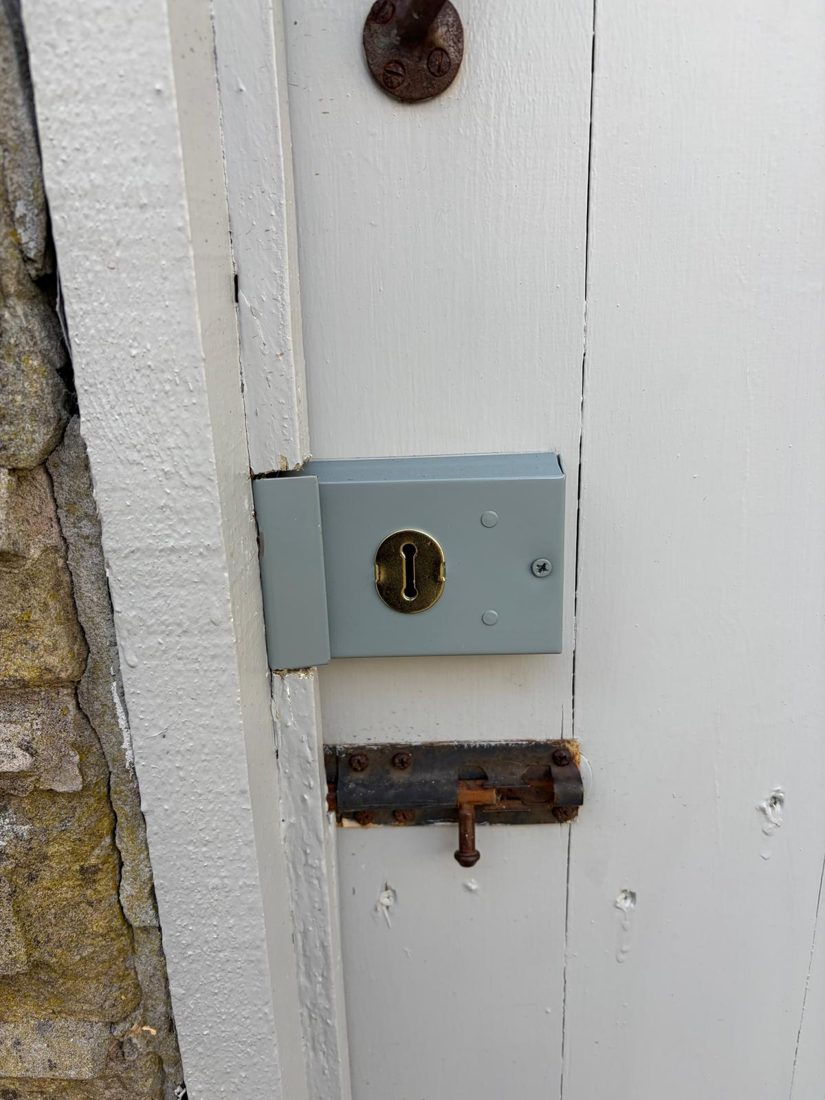 A rim deadlock fitted to a shed door with a reinforced keep