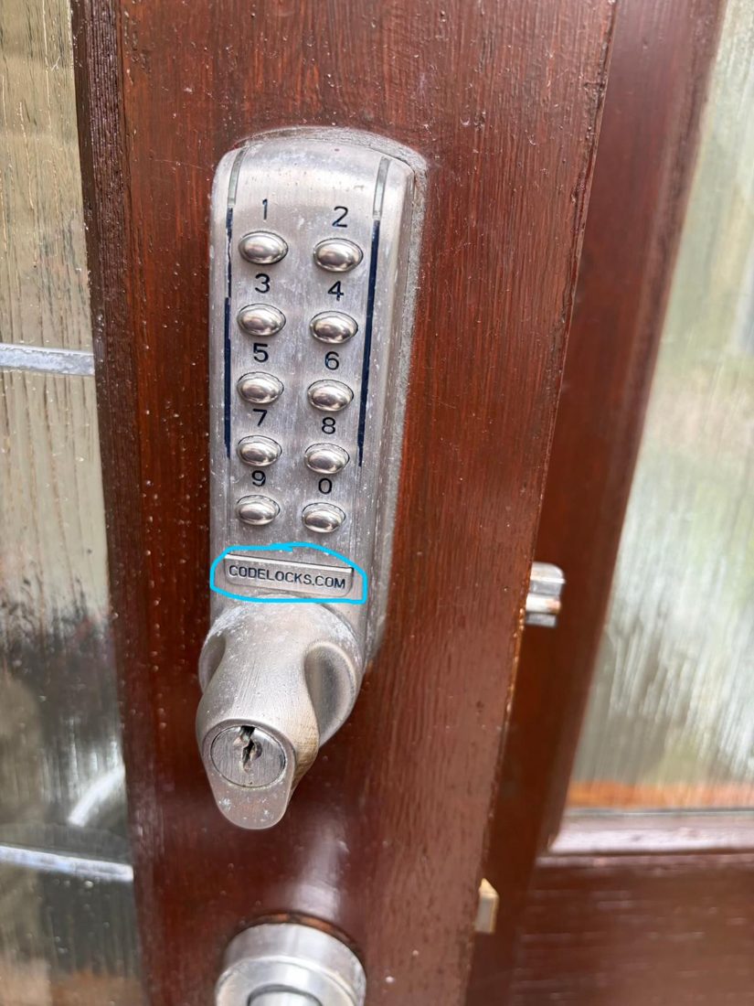 A mechanical push-button code lock fitted to a timber door, no batteries or app required