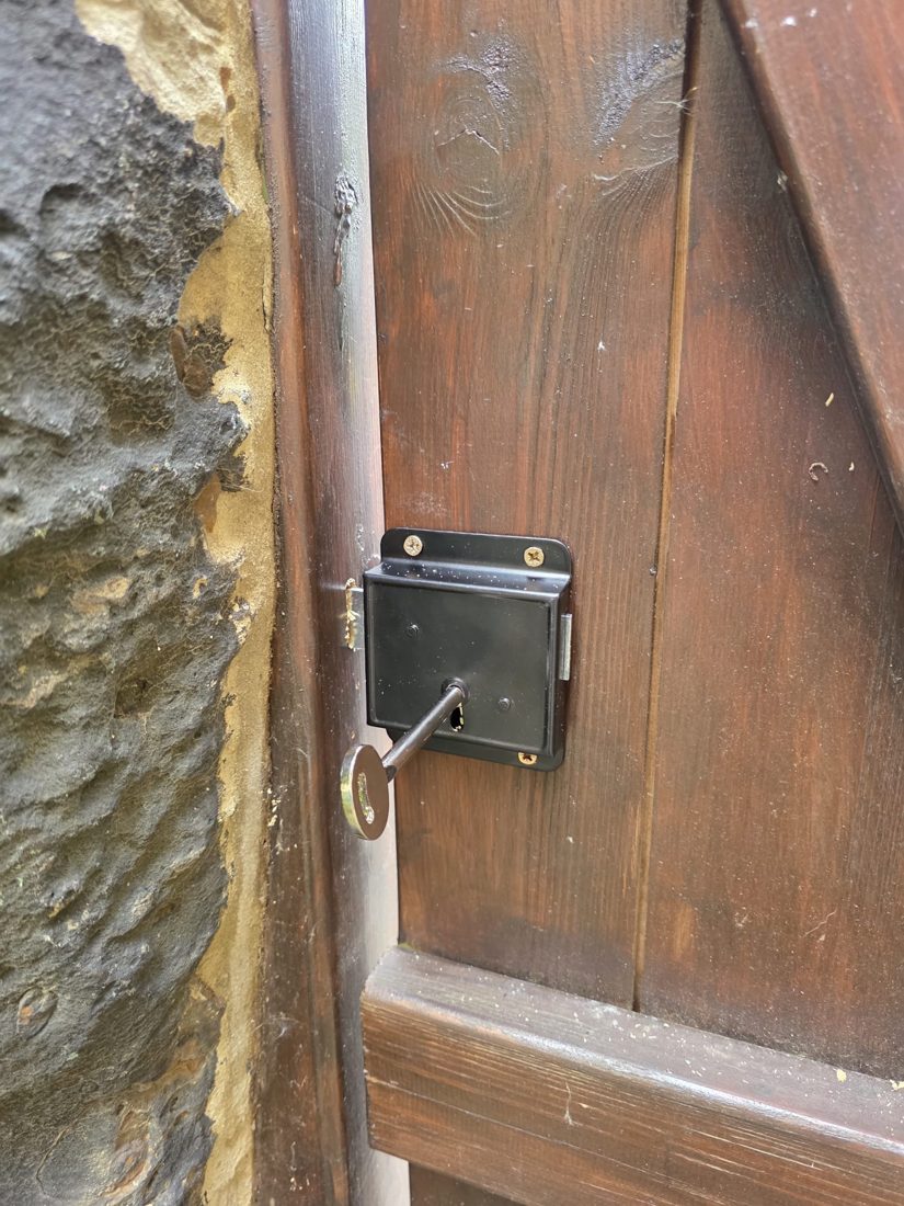 A rim deadlock fitted to a timber shed door