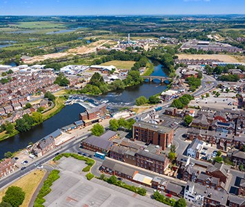 An aerial view over Castleford, with the River Aire curving through the town centre