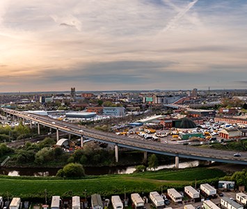 An aerial view across Doncaster, with the River Don and the town-centre skyline beyond