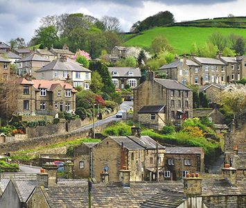 Stone houses stacked up the steep valley sides at Holmfirth, the layered hillside terraces typical of this Pennine town