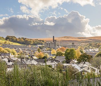 The Colne Valley village of Marsden, its rooftops gathered below the high Pennine moors at the head of the valley