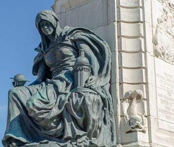 A bronze figure on the base of the Queen Victoria monument in Queen Victoria Square, at the centre of Hull's civic heart