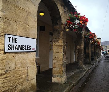 The Shambles in Wetherby, the historic colonnade of stone arches built as butchers' shops, now home to independent shops and cafés