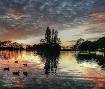 The lake at Pontefract Park at dusk, set within the racecourse circuit and a well-loved local spot for walks and waterfowl on the edge of the town
