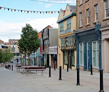 A pedestrianised street in Rotherham town centre, with its mix of traditional and timber-framed buildings