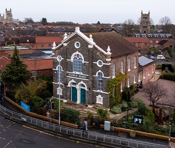 Selby Town Hall, with the towers of Selby Abbey rising behind it in the heart of nearby Selby