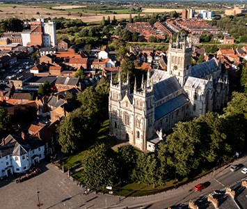 Selby Abbey, the Grade I listed former Benedictine abbey church founded in 1069 — one of the largest parish churches in Britain — rising above the rooftops of the market town